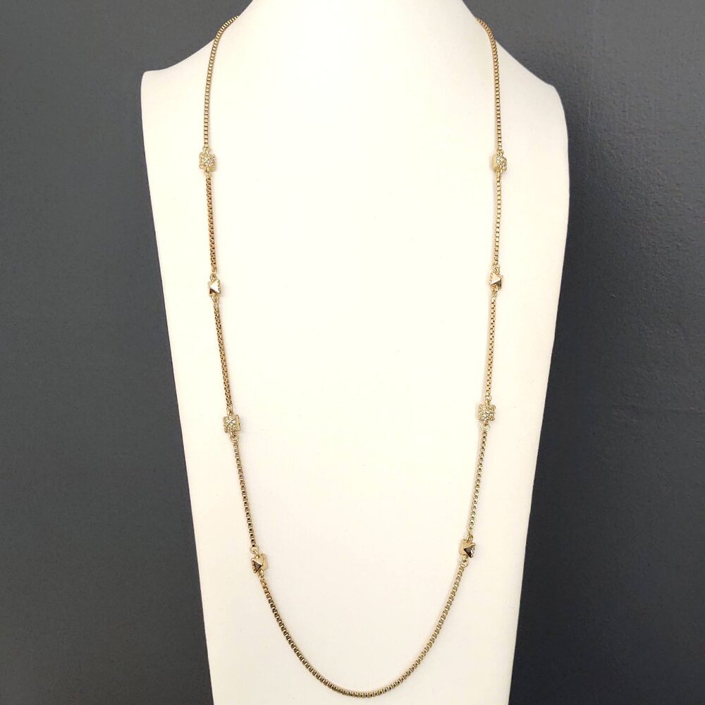 Gold box chain necklace with gold and crystal pyramid accents